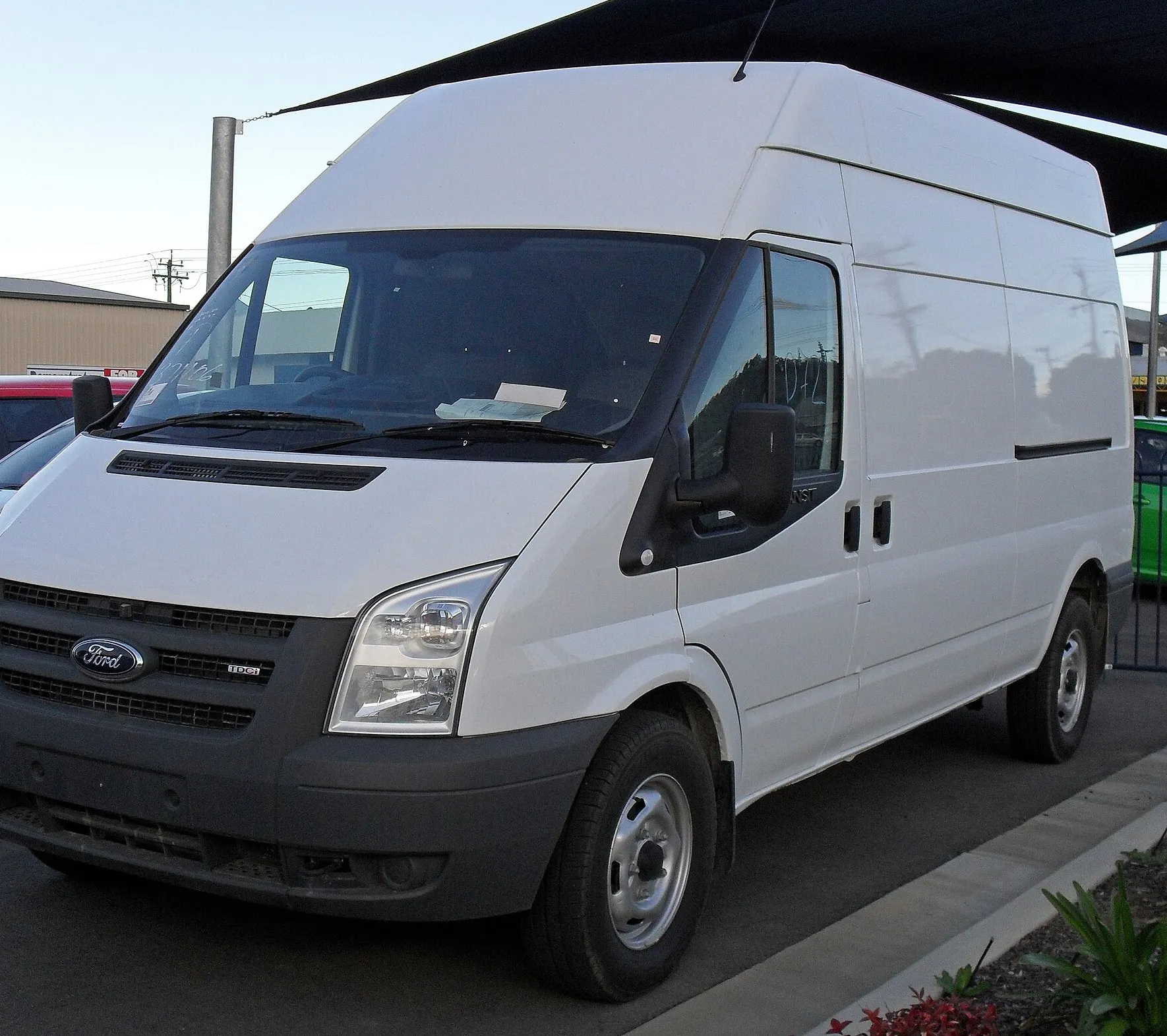 Large white long-wheelbase collection van of the kind that visits your kitchen on a fixed day